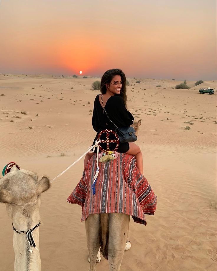 tourists enjoying dune bashing in dubai, bbq dinner in dubai desert with entertainment and also enjoying views of burj al arab , burj khalifa, palm jumeirah, royal atlantis, bluewaters isalnd onCity Tour Desert Safari from Wyndham Dubai Marina