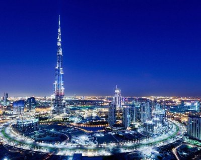 tourists enjoying views of bastakiya old quarter dubai, abra rides, burj al arab, burj khalifa, bluewaters isalnd, palm island, bvlagari island on City Tour Desert Safari from Four Points By Sheraton Sheikh Zayed Road