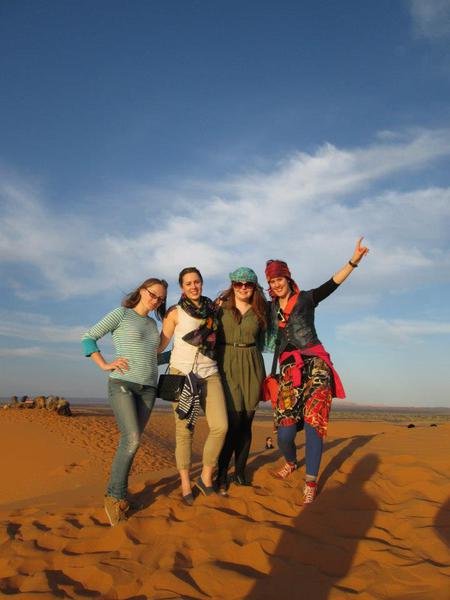 group of tourists enjoying the dune bashing in ras al khaimah desert, bbq dinner with entertainment in ras al khaimah desert, quad biking, on DESERT SAFARI TOUR IN RAS AL KHAIMAH